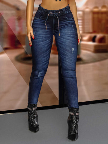 Jeans jogger bleu avec cravate dorée Jeans jogger bleu avec cravate dorée